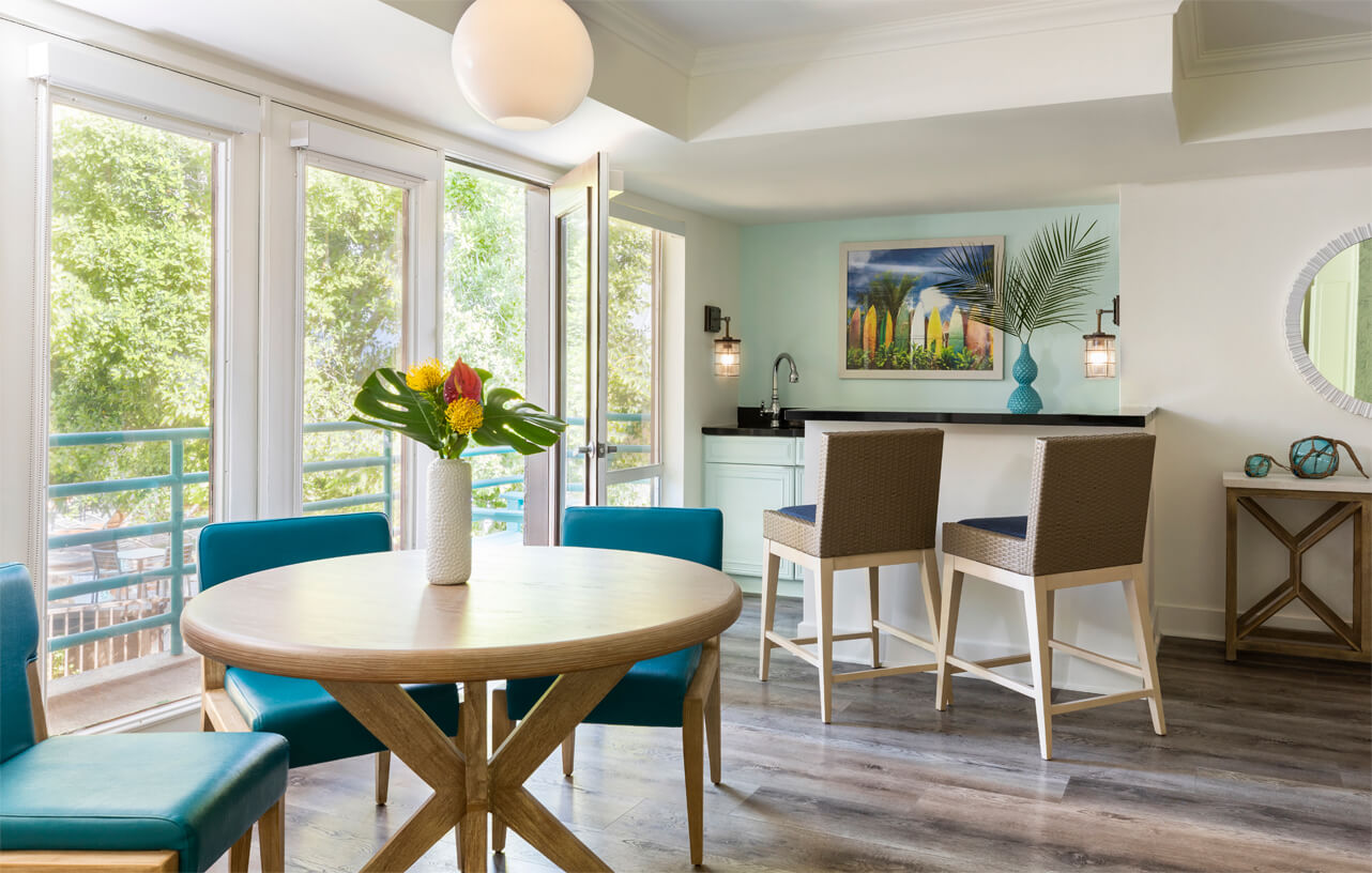 Sage-Suite a room with a table and chairs